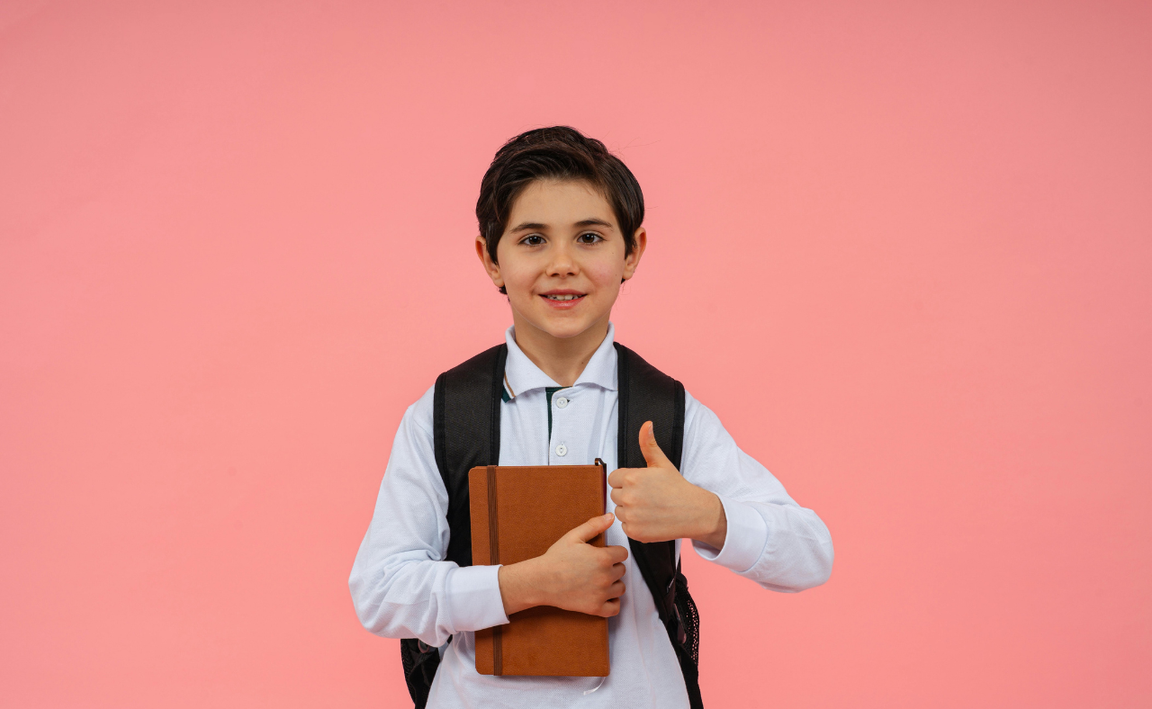 Indian school students holding books in school uniform on campus